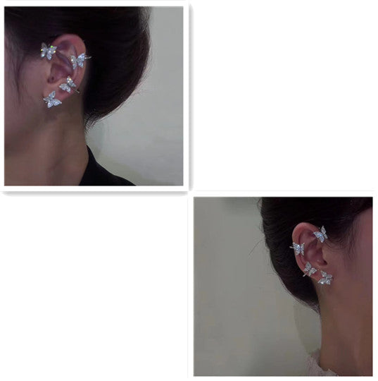 Silver butterfly ear cuff jewelry with glitter butterfly charms on ear, side view
