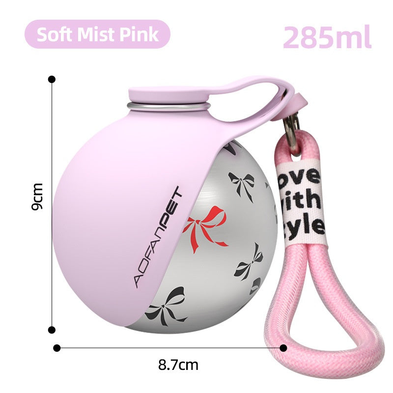 Soft mist pink stainless steel pet water bottle with handle and pink loop strap.
