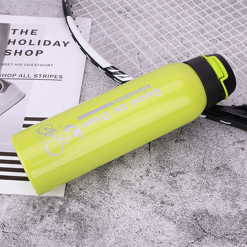 Bike water bottle in lime green with black flip cap
