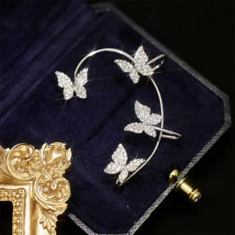 Silver butterfly ear cuff with sparkle stones on thin hoop, clip-style closure