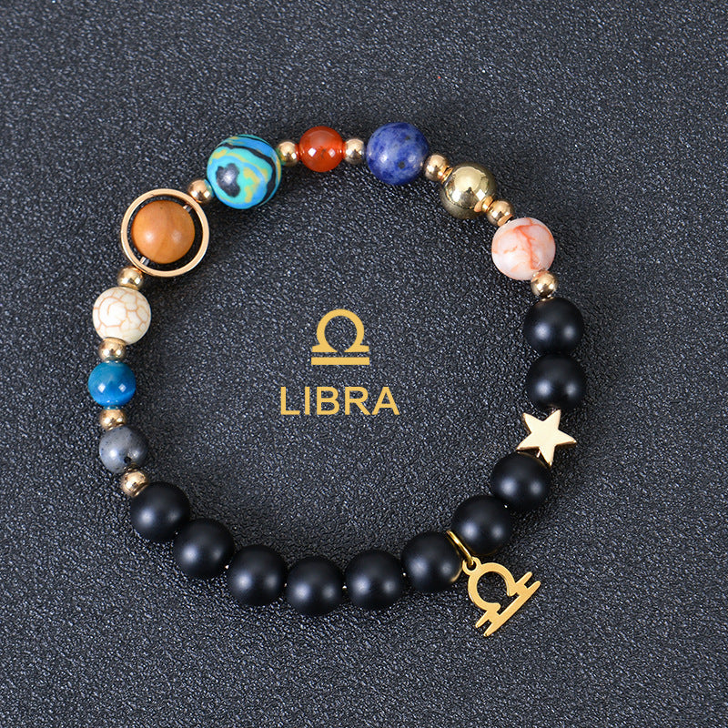 Libra zodiac beaded bracelet with black lava stones, star charm, and gold accents