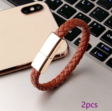 Brown braided charging cable bracelet with rose-gold metal clasp and USB connector
