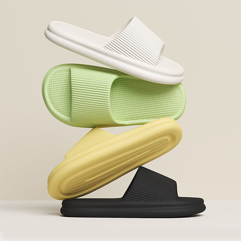 Lime green, yellow, and white slip-on home slippers with ribbed uppers