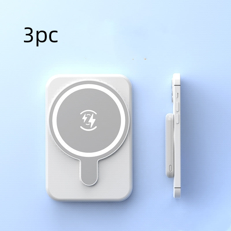 Set of three white mini magnetic wireless power banks with charging icon