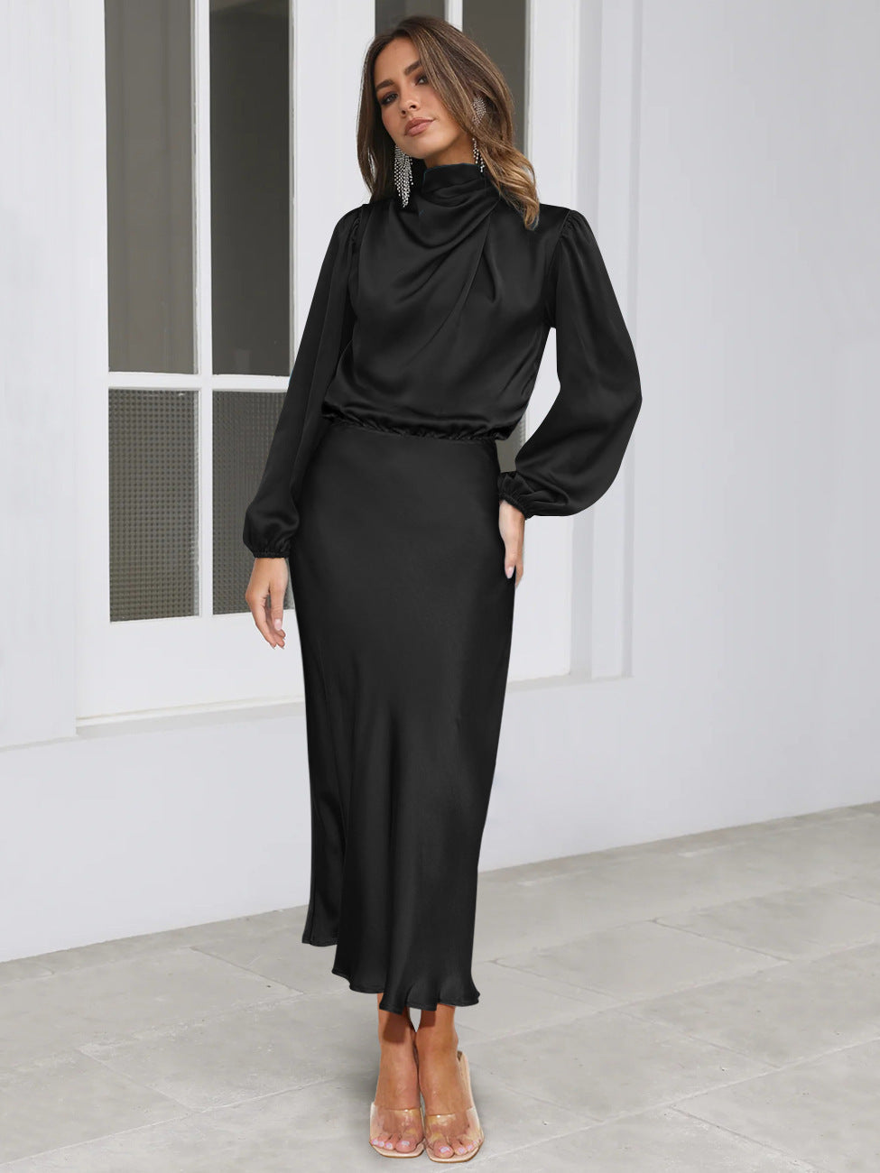 Black long-sleeved satin midi dress with high collar and puff sleeves