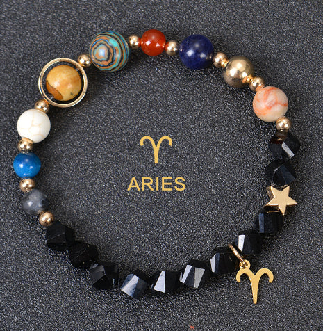 Zodiac bracelet with black lava beads and Aries charm, star and gold zodiac charm.