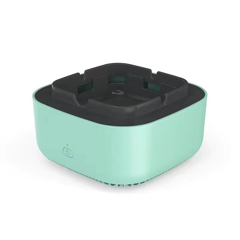Mint green electronic ashtray air purifier with black inner bowl and circular power icon