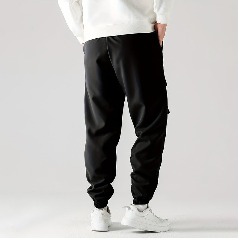 Black straight ankle cargo jogger pants with elastic cuffs and utility side pockets