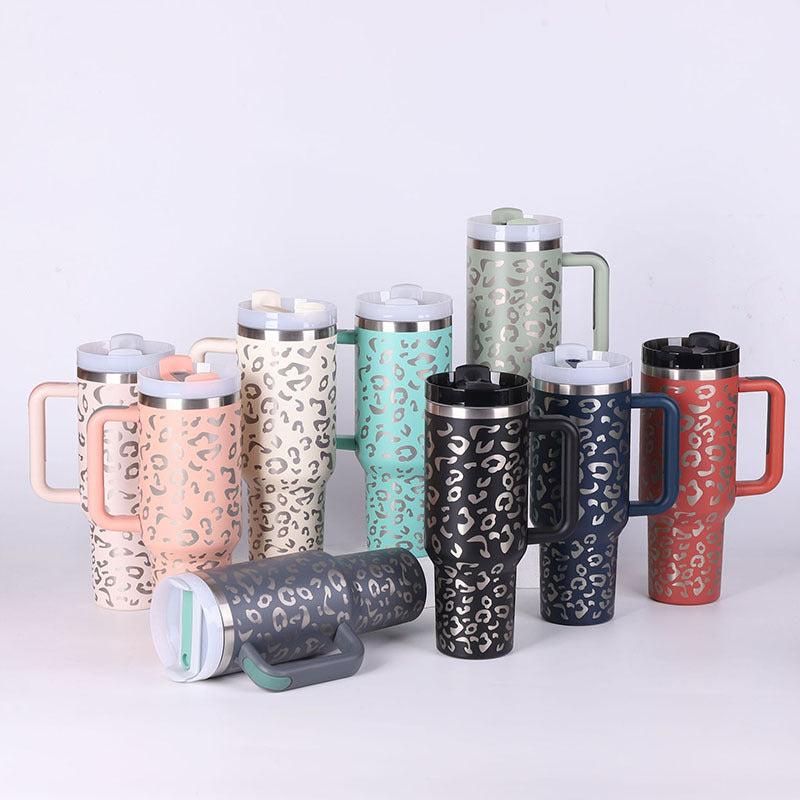Insulated tumblers with handles and straws; leopard prints in pink, tan, green, and black