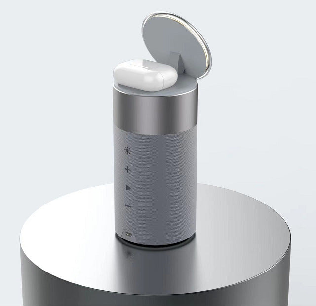 3-in-1 wireless charger speaker with lamp, close-up of grey cylinder and open charging top