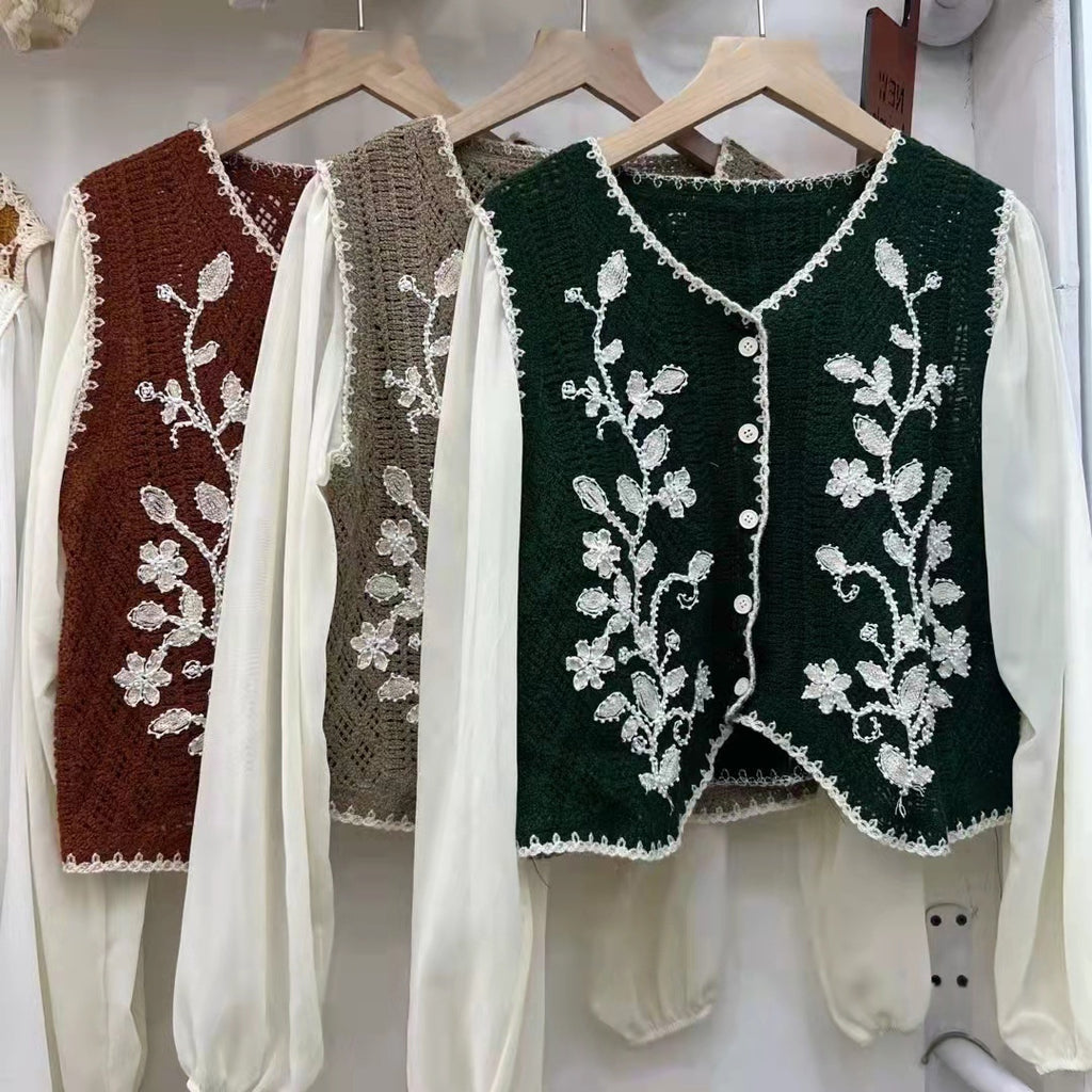 Embroidered V-neck sleeveless tops, maroon, taupe and dark green, on hangers
