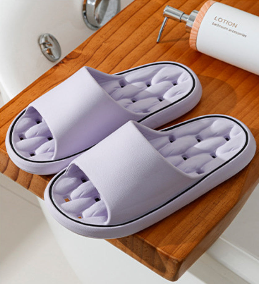 Lilac open-toe slide slippers with thick sole and molded cushioned footbed.