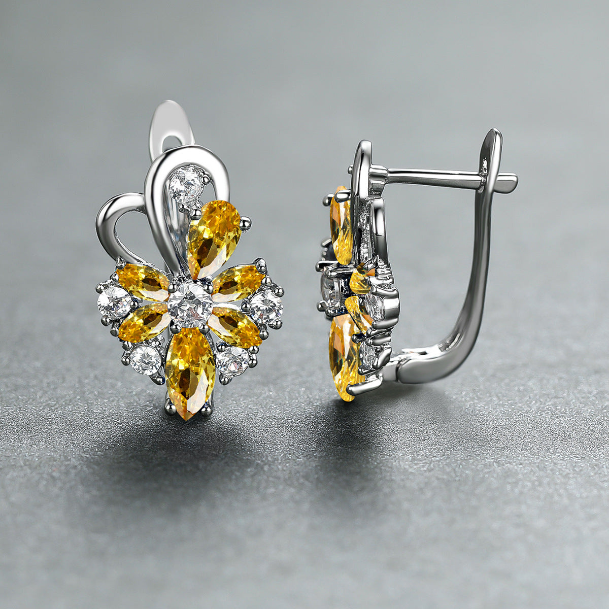 Silver-tone drop earrings with yellow pear and marquise stones, clear flower accents