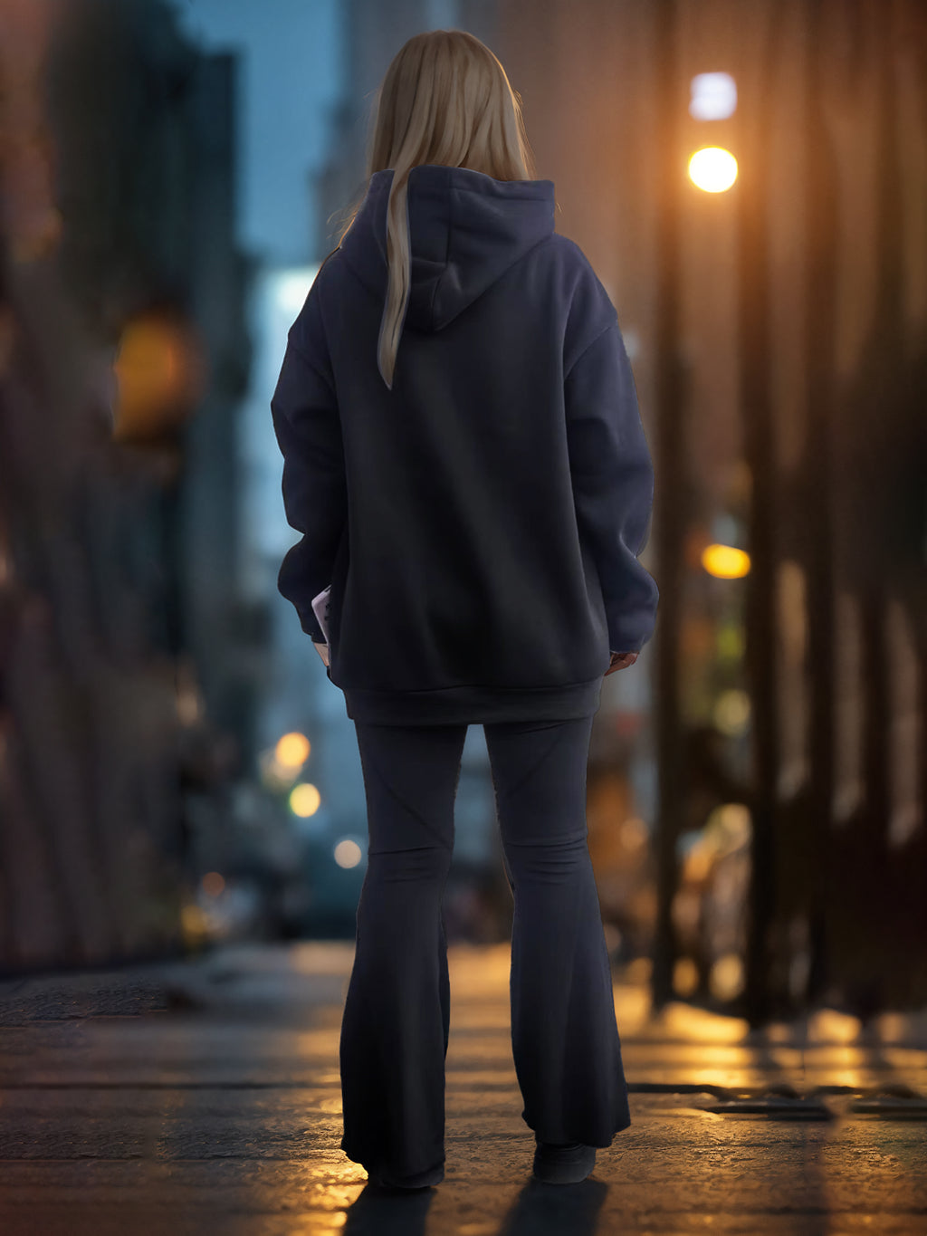 Black long-sleeve hoodie back view with hood and drawstrings, relaxed fit