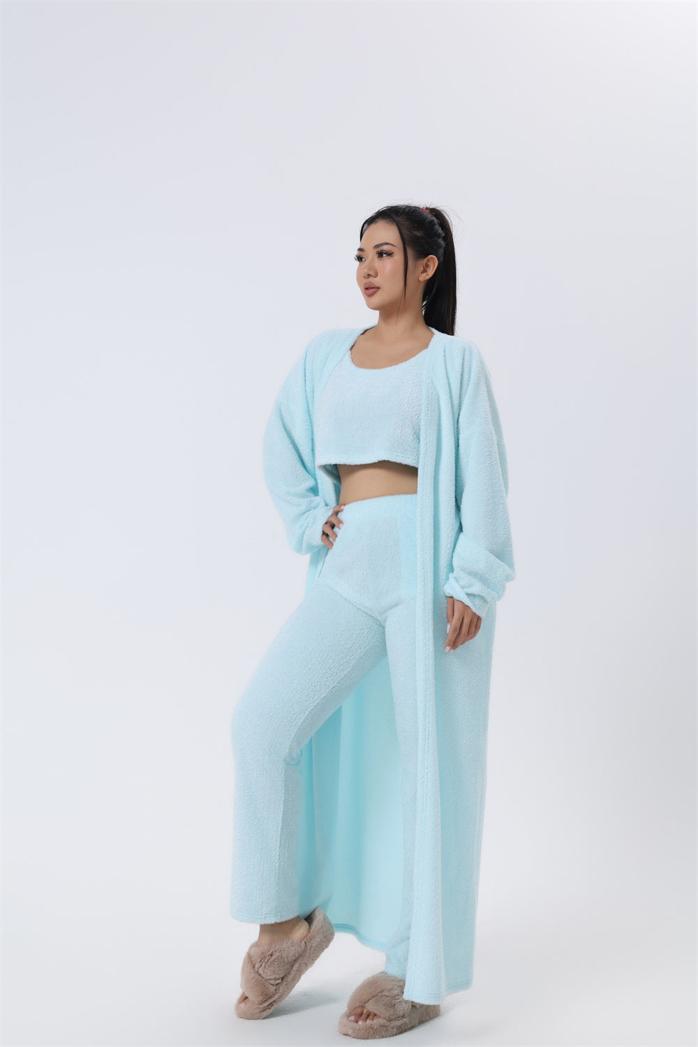 Women’s 3-piece pajama set in light blue: crop top with long cardigan robe and pants.