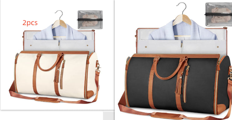 Set of travel duffle bags in white and dark gray with brown tassel zipper pulls