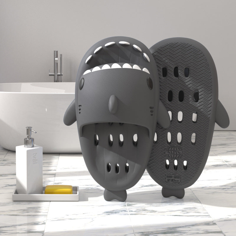 Dark gray shark-shaped EVA shower slide with drainage holes and grippy sole