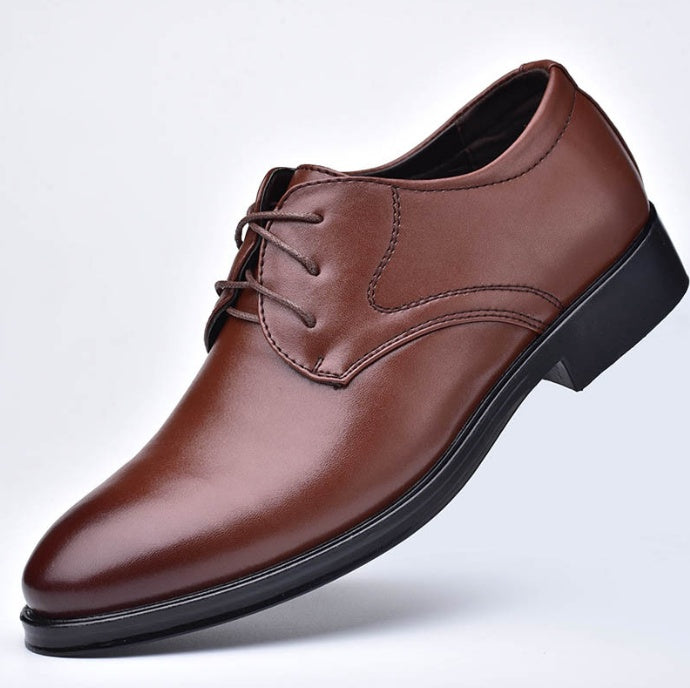 Men's pointed-toe lace-up dress shoes, brown leather upper with dark trim sole.