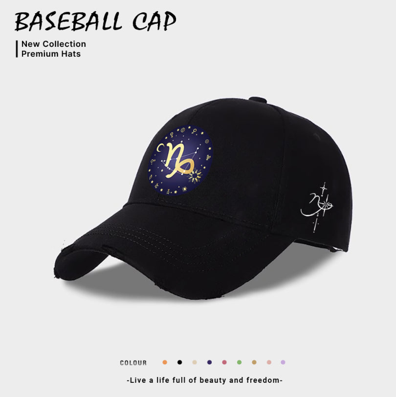 Black baseball cap with blue-and-gold zodiac emblem on front, white side zodiac constellation