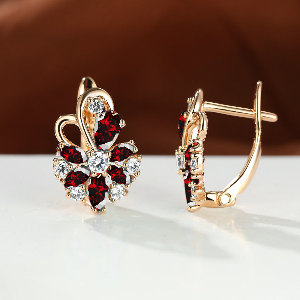 Gold-tone drop earrings with red marquise stones and clear round sparkle accents
