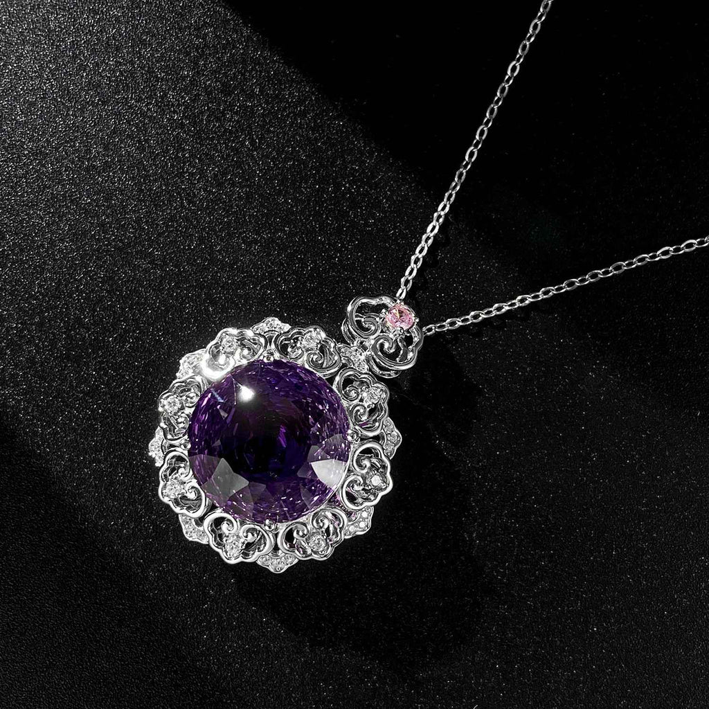Silver amethyst pendant necklace with round purple stone and filigree halo