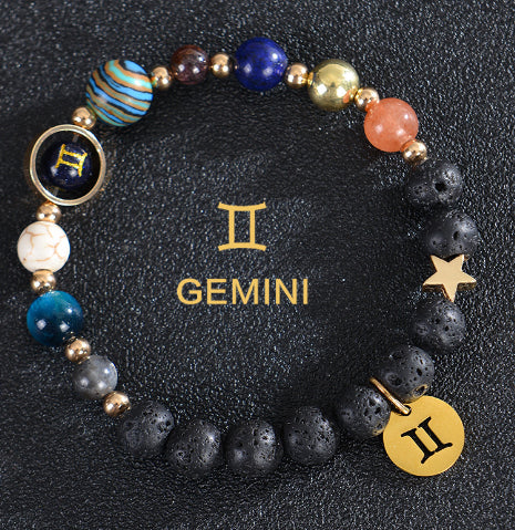 Gemini zodiac beaded bracelet with black lava stones and gold Gemini medallion charm