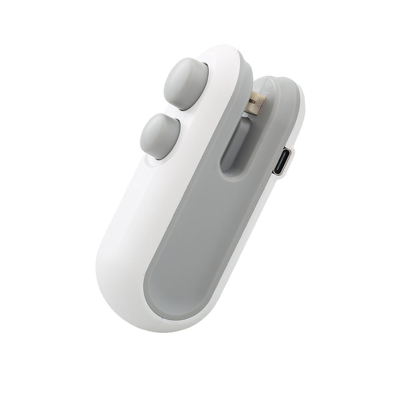 Handheld white heat sealer with oval buttons, USB port on side