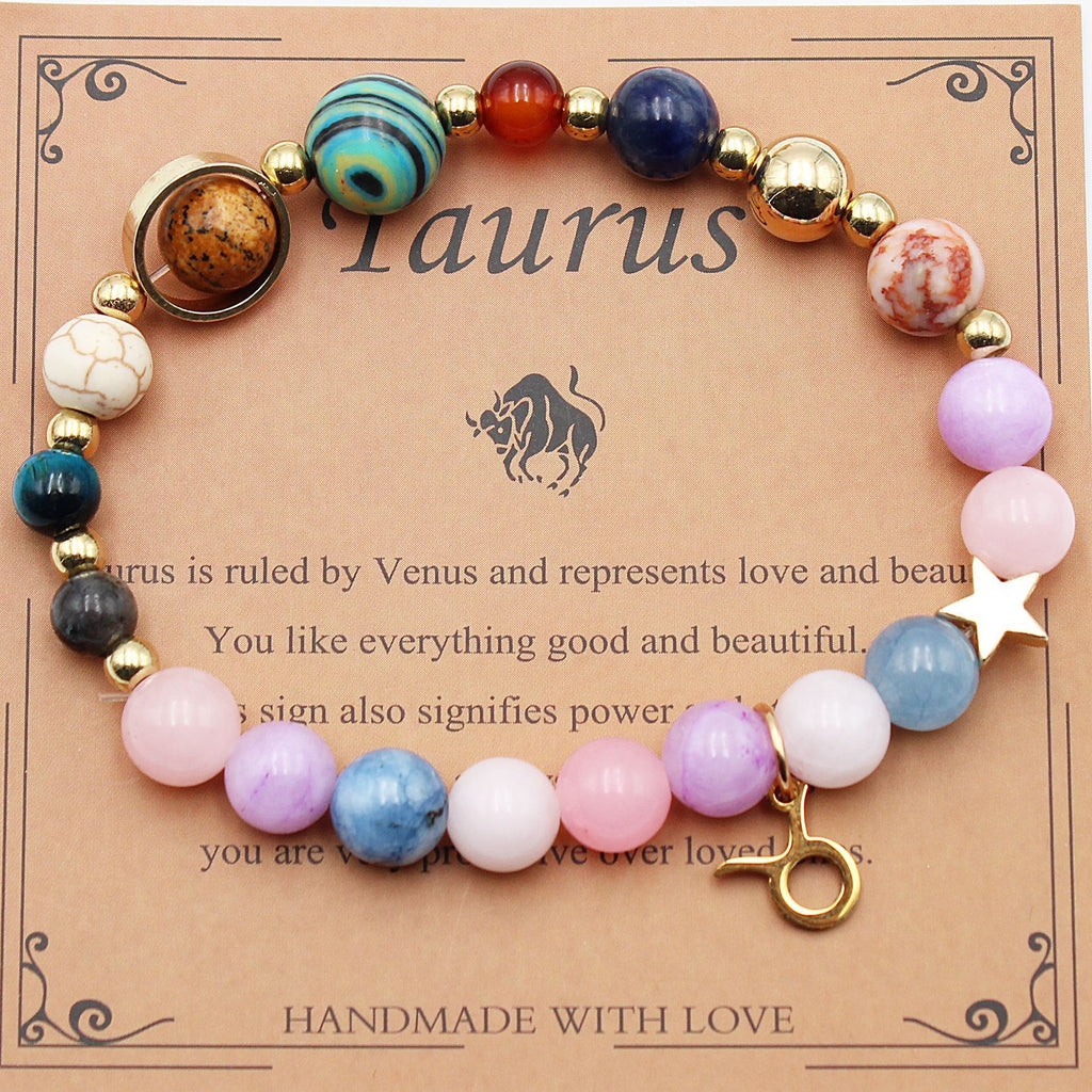 Taurus zodiac beaded bracelet with lilac, pink, and blue beads, gold clasp