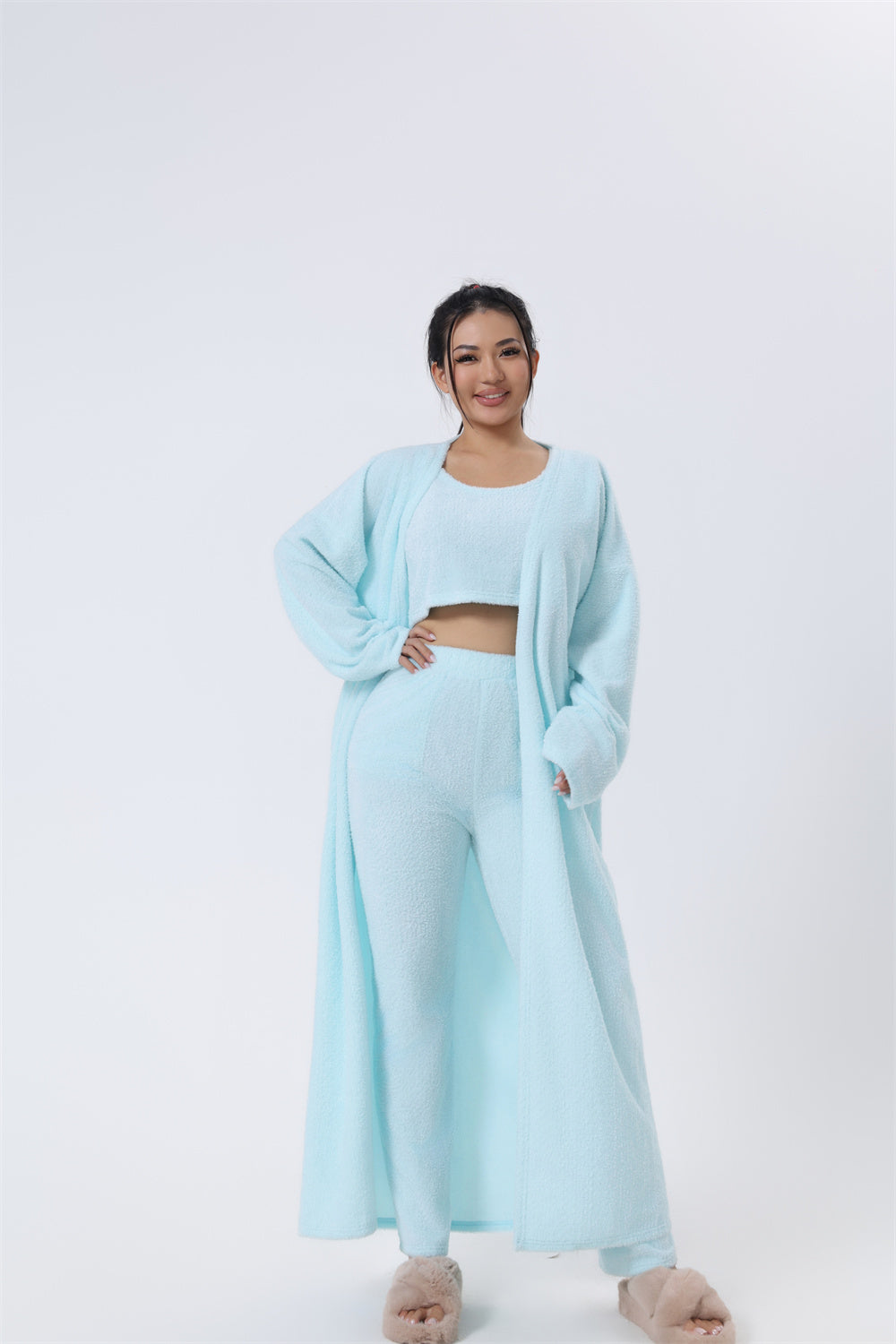 Women’s 3-piece pajama set in light blue: cropped tank top, matching pants, long robe.