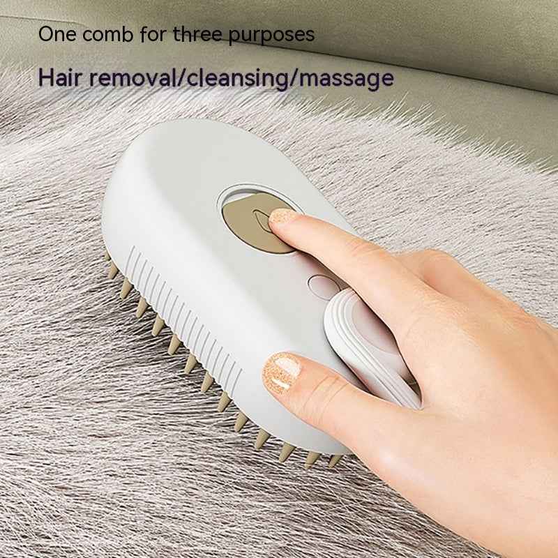 White electric pet grooming brush with beige control panel and orange-tipped bristles