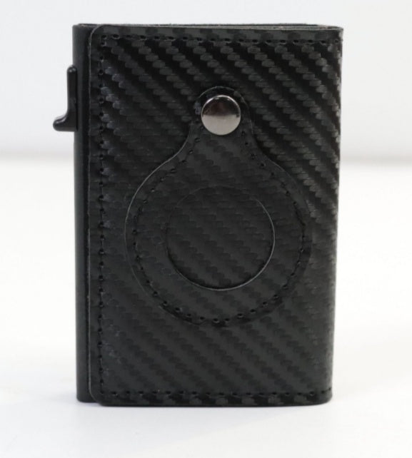 Black carbon-fiber card wallet with circular AirTag cutout and metal snap button