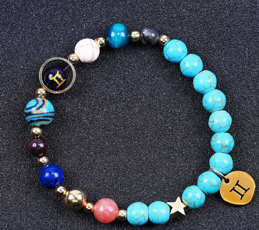 Turquoise beaded bracelet with mixed gemstone beads and bronze zodiac charm disk