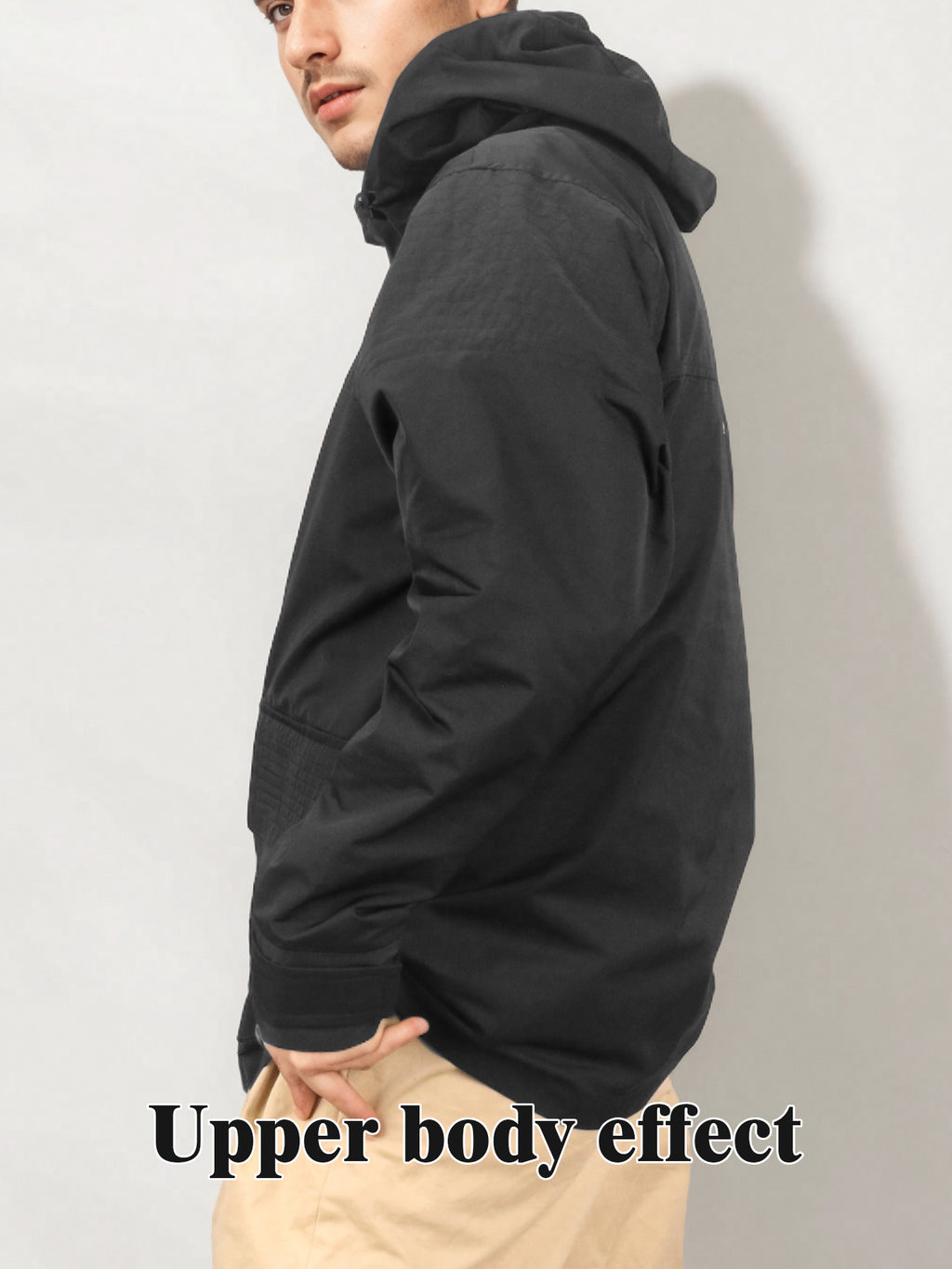 Black hooded rain jacket, side view, snap front and front pocket flap