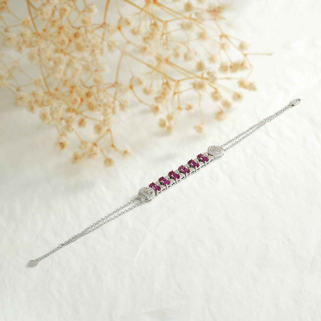 Sterling silver chain bracelet with purple stone bar centerpiece and slider clasp