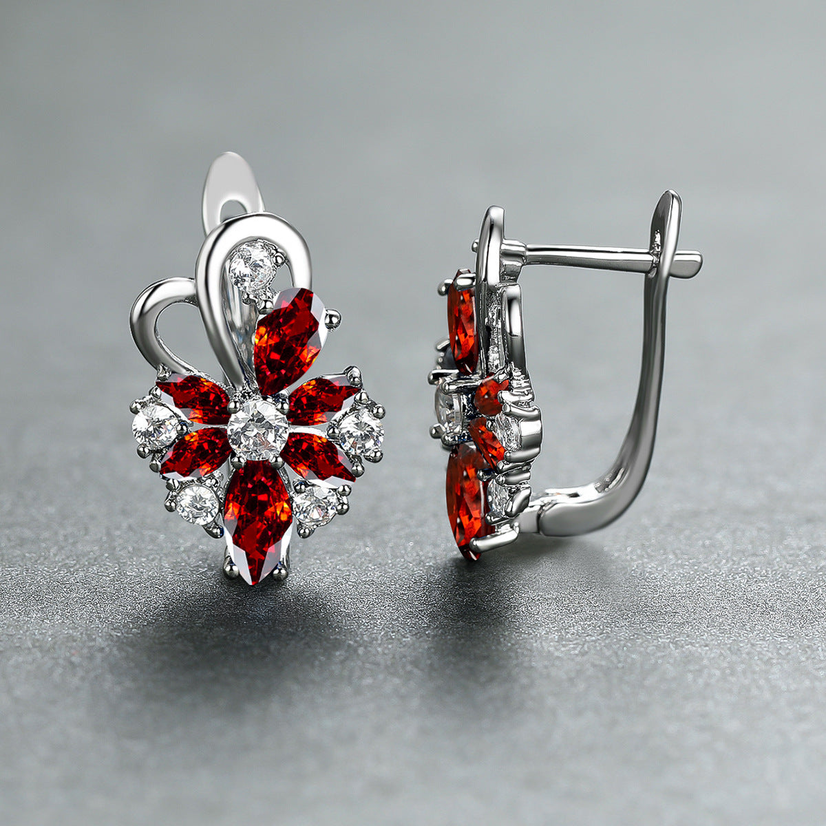 Silver-tone drop earrings with red marquise and pear stones, clear flower accents