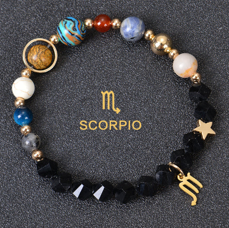 Zodiac beaded bracelet with black faceted beads, gold spacers, Scorpio charm and star