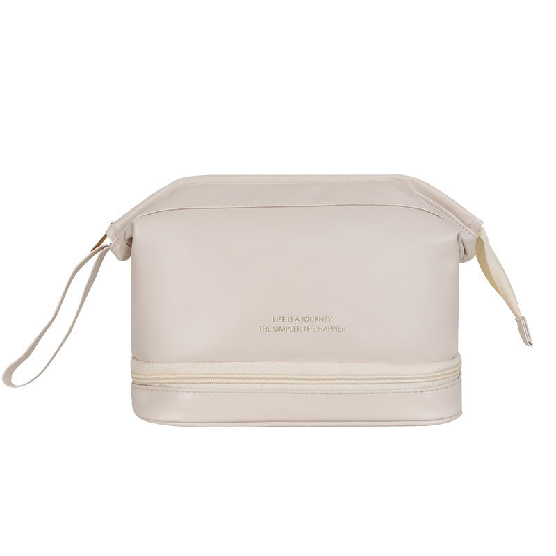 Large travel cosmetic bag in light beige with top zipper and side draw cords