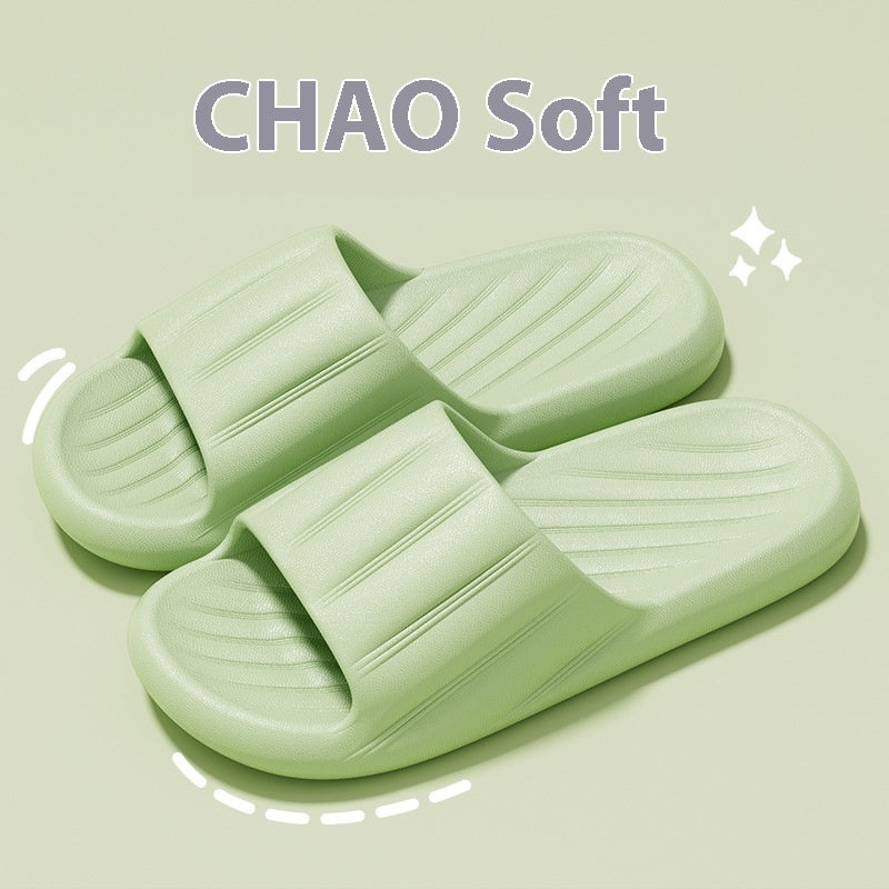 Light green slide slippers with striped strap and molded ribbed footbed