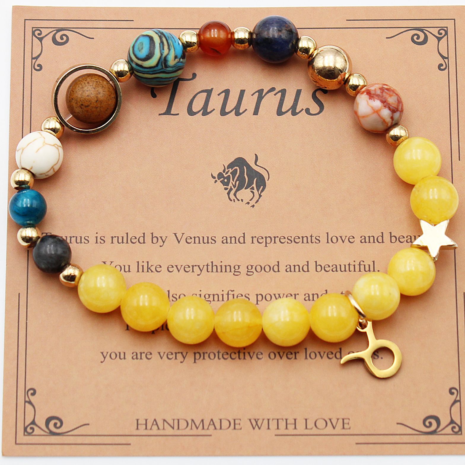 Beaded zodiac bracelet with yellow beads, gold spacers, star charm and gold key charm
