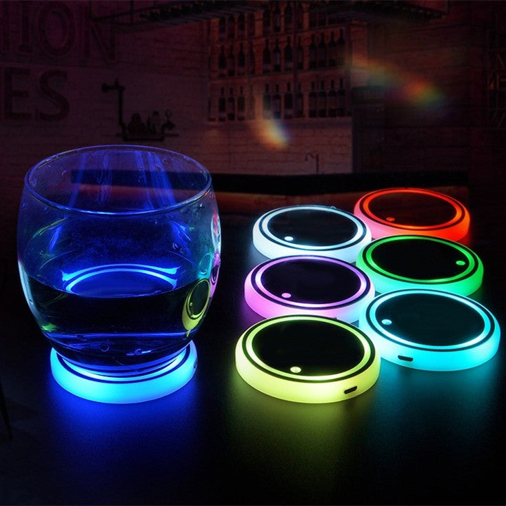 Blue LED light-up coaster with a glowing ring under a drink cup