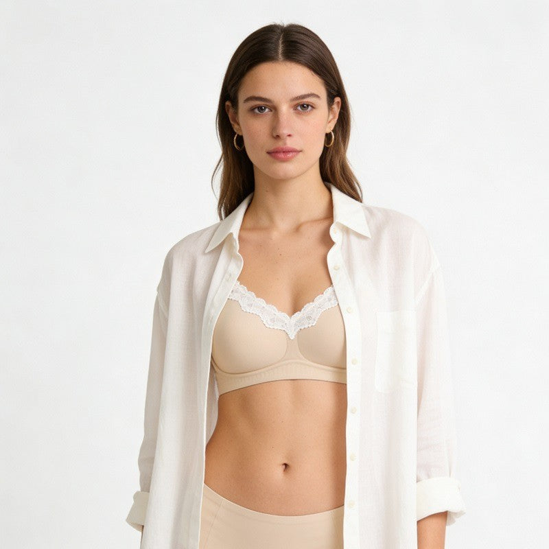 V-neck lace seamless bra, light beige cups with white lace V-neck trim, front view