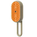 Beige electric pet grooming comb with orange bristle face and upright handle
