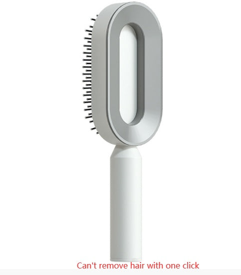 Self-cleaning hair brush with gray oval head and white handle