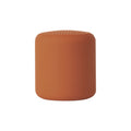 Portable wireless mini speaker, orange cylinder with perforated top grille