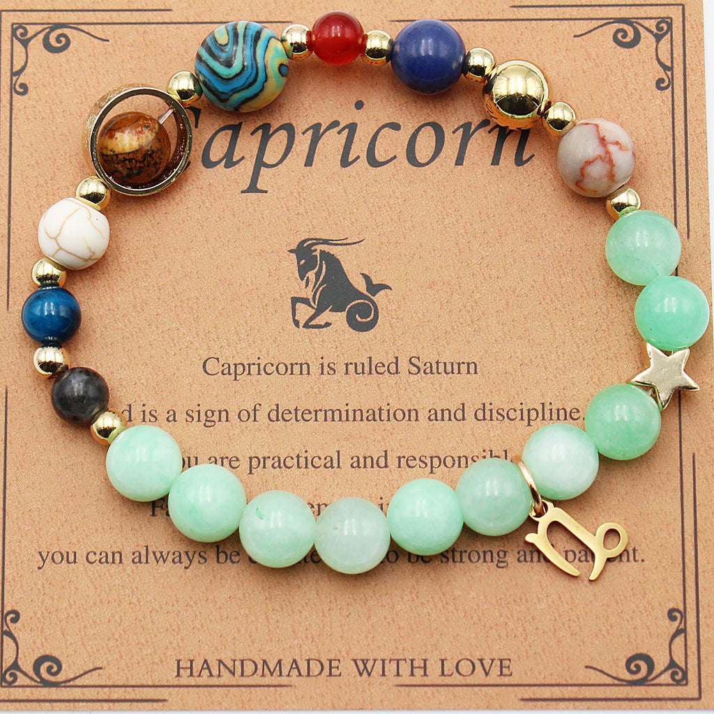 Capricorn zodiac beaded bracelet with mint green beads, gold star charm, and stone accents