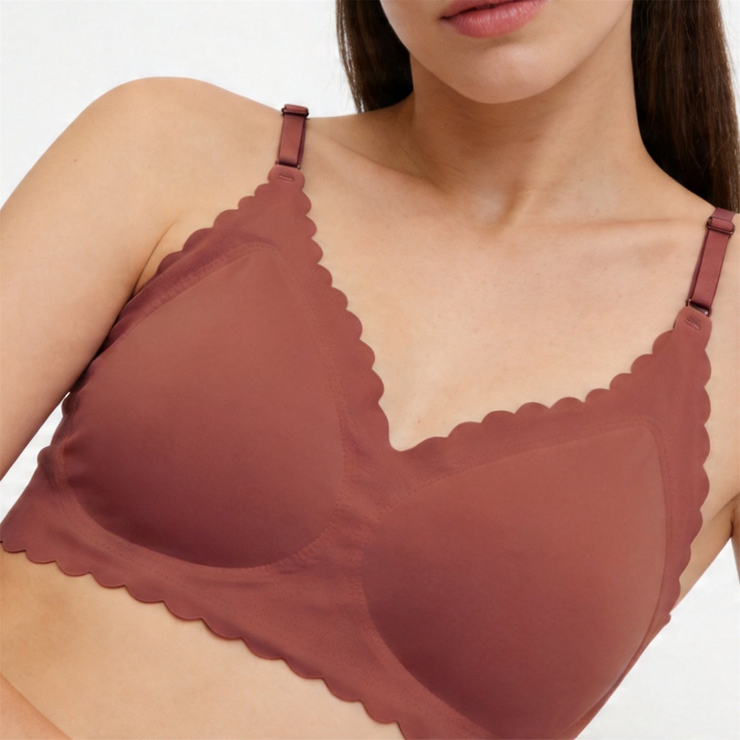 Brick red wireless deep V bra with scalloped trim and adjustable shoulder straps
