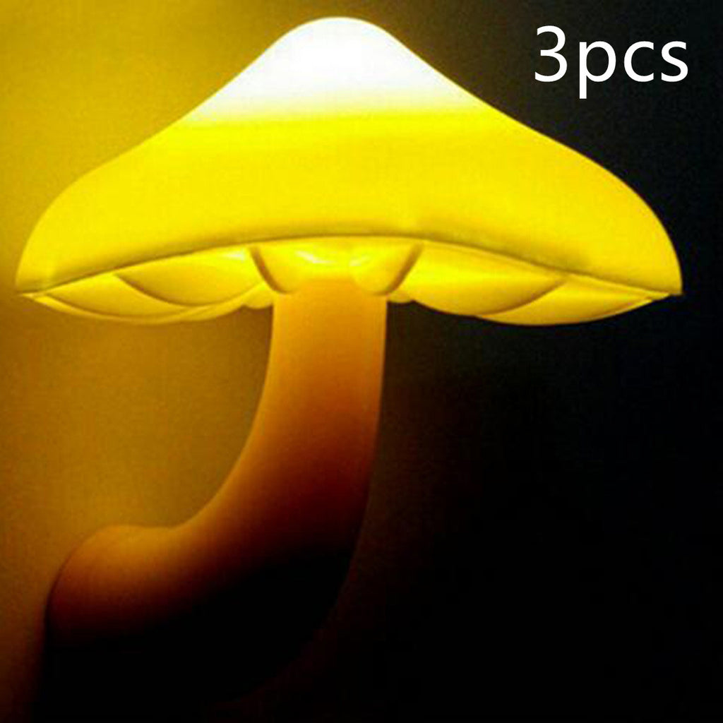 Mushroom night light wall plug lamp with yellow glowing mushroom head, close view
